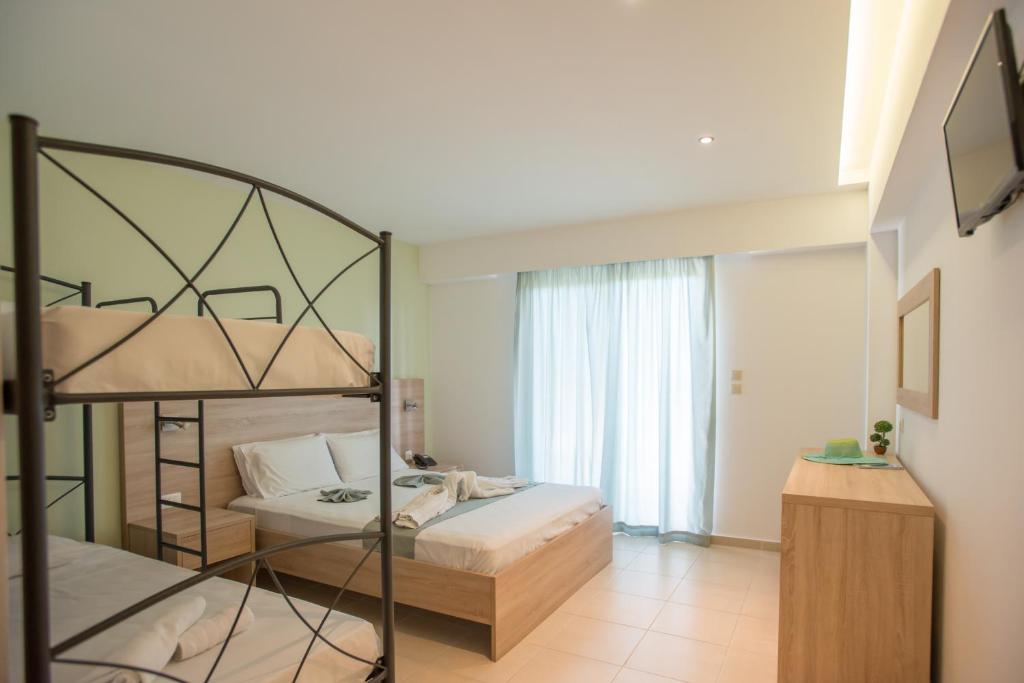 Postel nebo postele na pokoji v ubytování Meliton Hotel