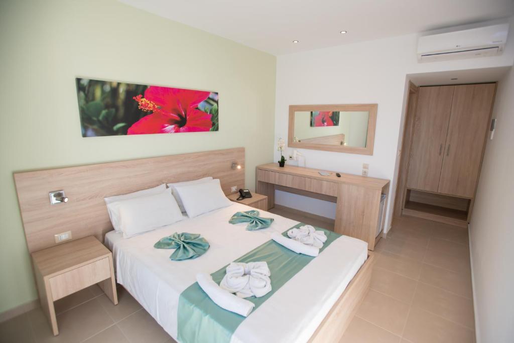 Postel nebo postele na pokoji v ubytování Meliton Hotel