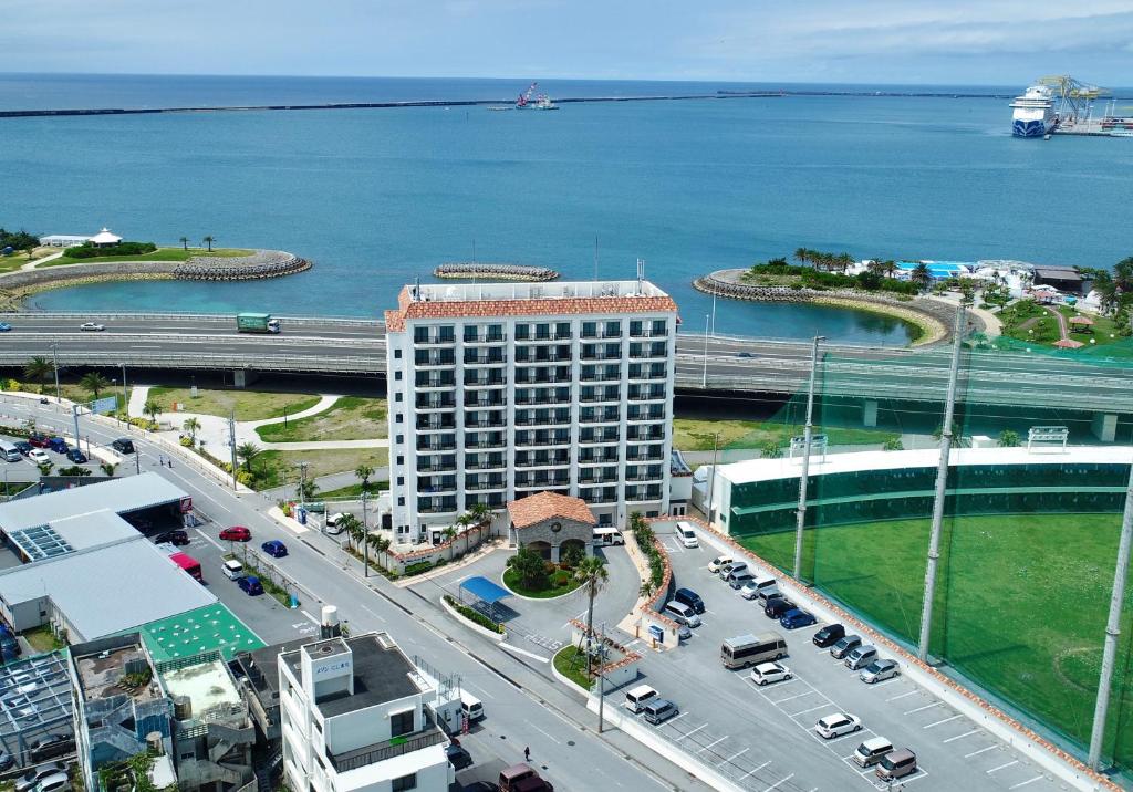 an aerial view of a building next to the water at Naha Beach Side Hotel in Naha