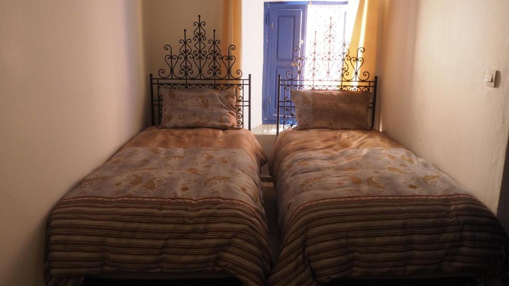 Postel nebo postele na pokoji v ubytování Riad Aventurine