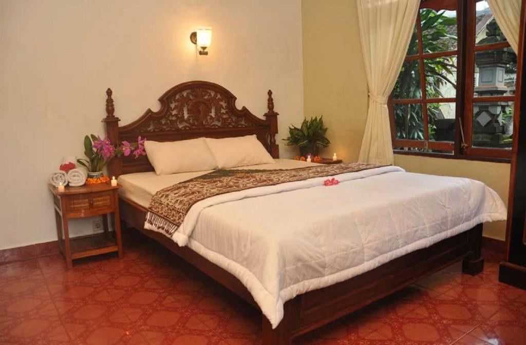 Postel nebo postele na pokoji v ubytování Candra Asri Bungalow
