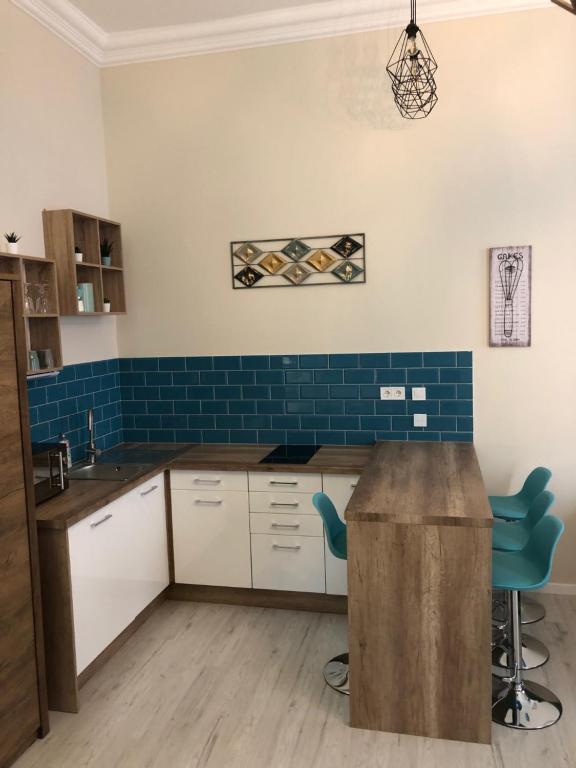 Kuchyňa alebo kuchynka v ubytovaní All In Apartman IV.