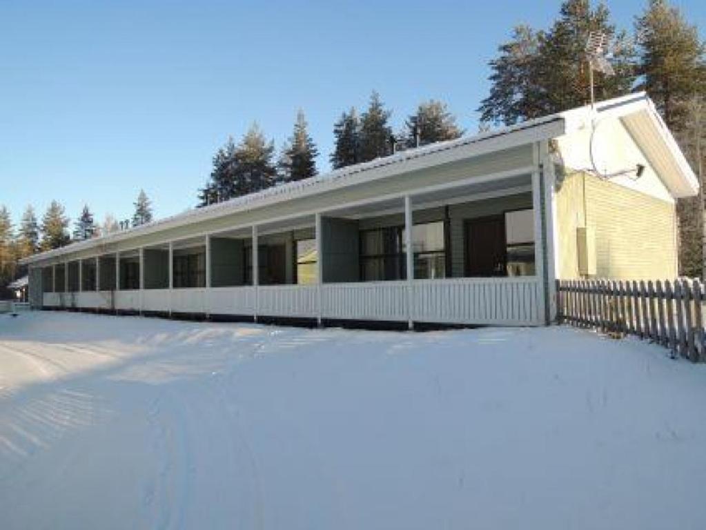 a house with snow in front of it at Kolin Aada 2 in Kolinkylä
