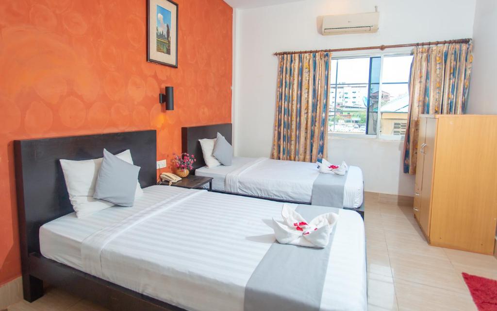 Postel nebo postele na pokoji v ubytování Best Central Point Hotel