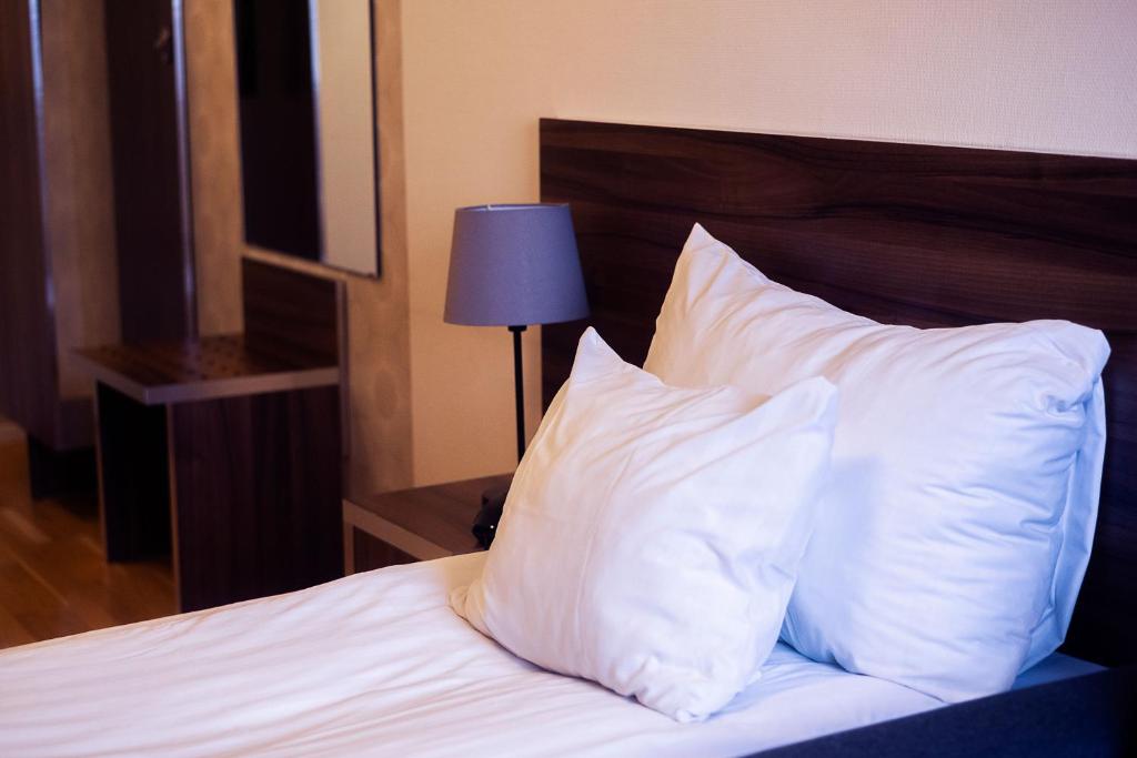 Postel nebo postele na pokoji v ubytování Hotell Wilhelmina