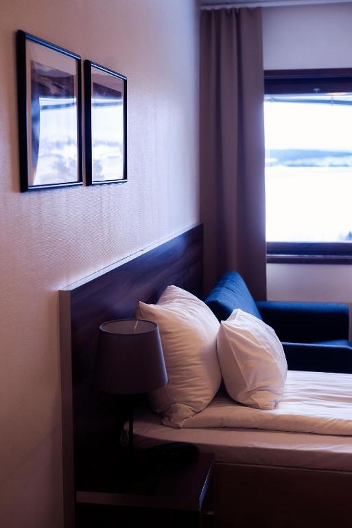 Postel nebo postele na pokoji v ubytování Hotell Wilhelmina