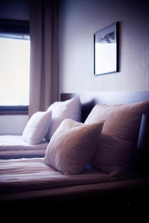 Postel nebo postele na pokoji v ubytování Hotell Wilhelmina