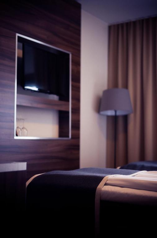 TV a/nebo společenská místnost v ubytování Hotell Wilhelmina