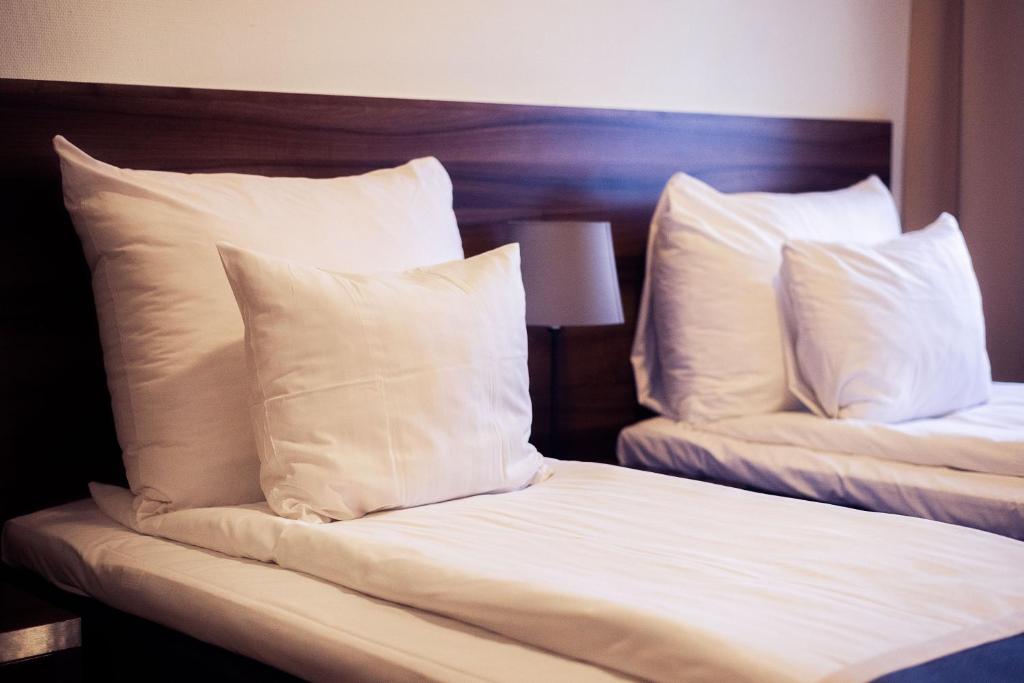 Postel nebo postele na pokoji v ubytování Hotell Wilhelmina