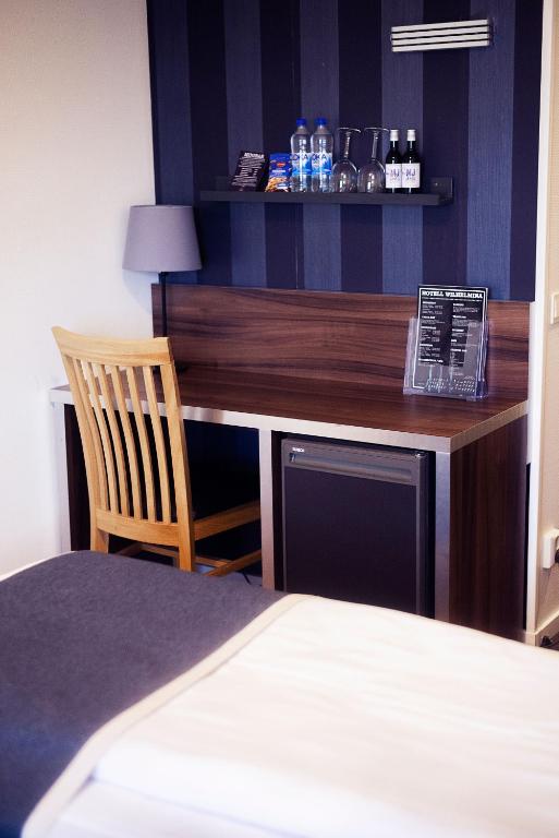 Postel nebo postele na pokoji v ubytování Hotell Wilhelmina