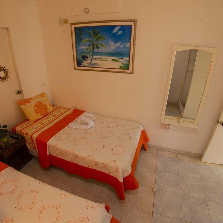 Postel nebo postele na pokoji v ubytování Posada Caribbean Refuge