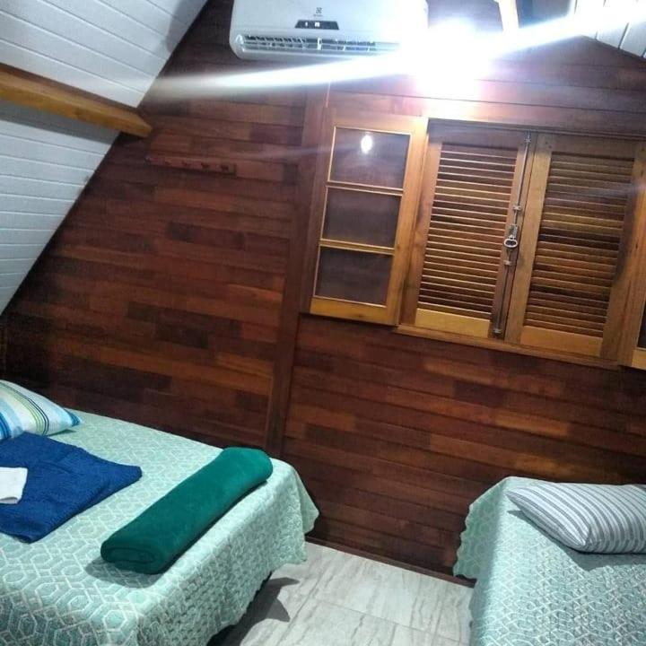 Postel nebo postele na pokoji v ubytování Residencial Chalés Riviera
