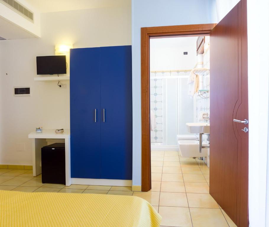 Postel nebo postele na pokoji v ubytování Gigli Hotel Salento