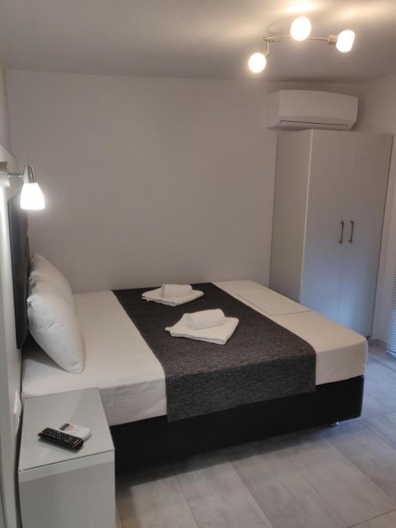 Postel nebo postele na pokoji v ubytování Alexion Apartments