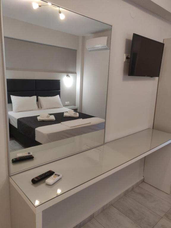 Postel nebo postele na pokoji v ubytování Alexion Apartments