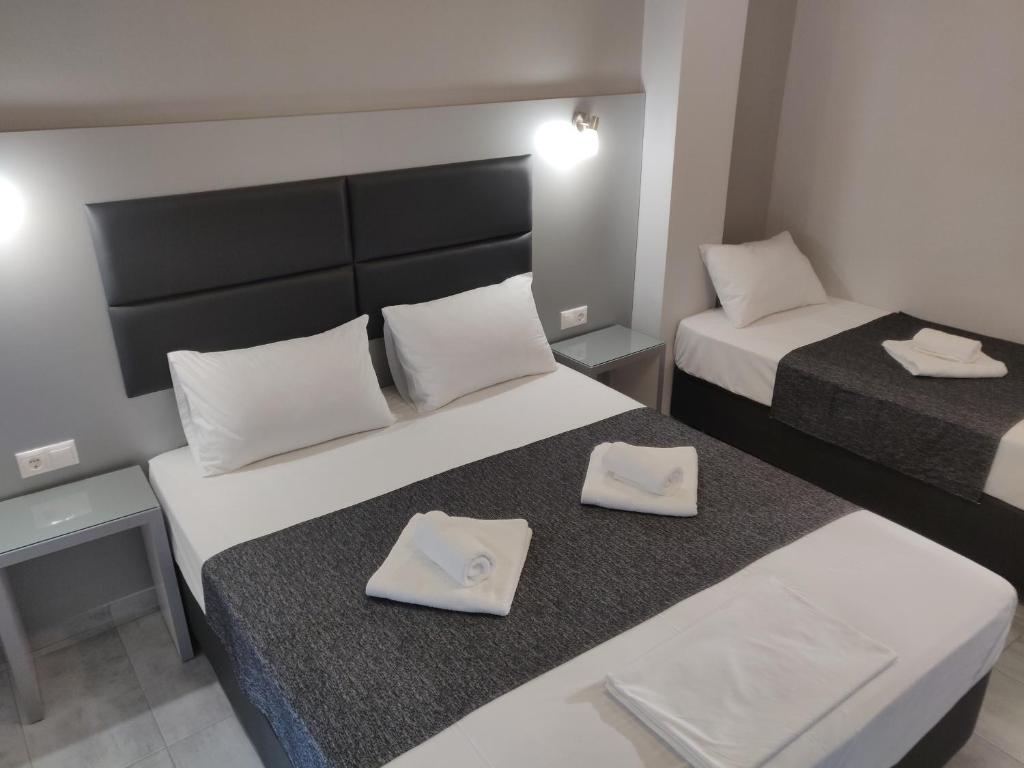 Postel nebo postele na pokoji v ubytování Alexion Apartments
