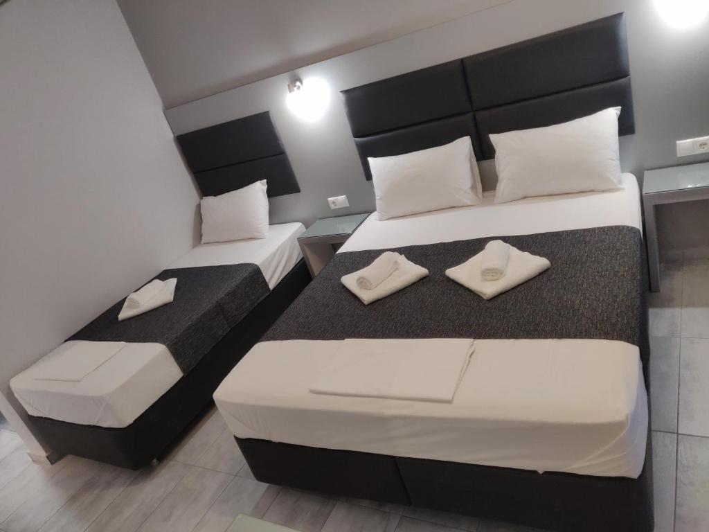 Postel nebo postele na pokoji v ubytování Alexion Apartments