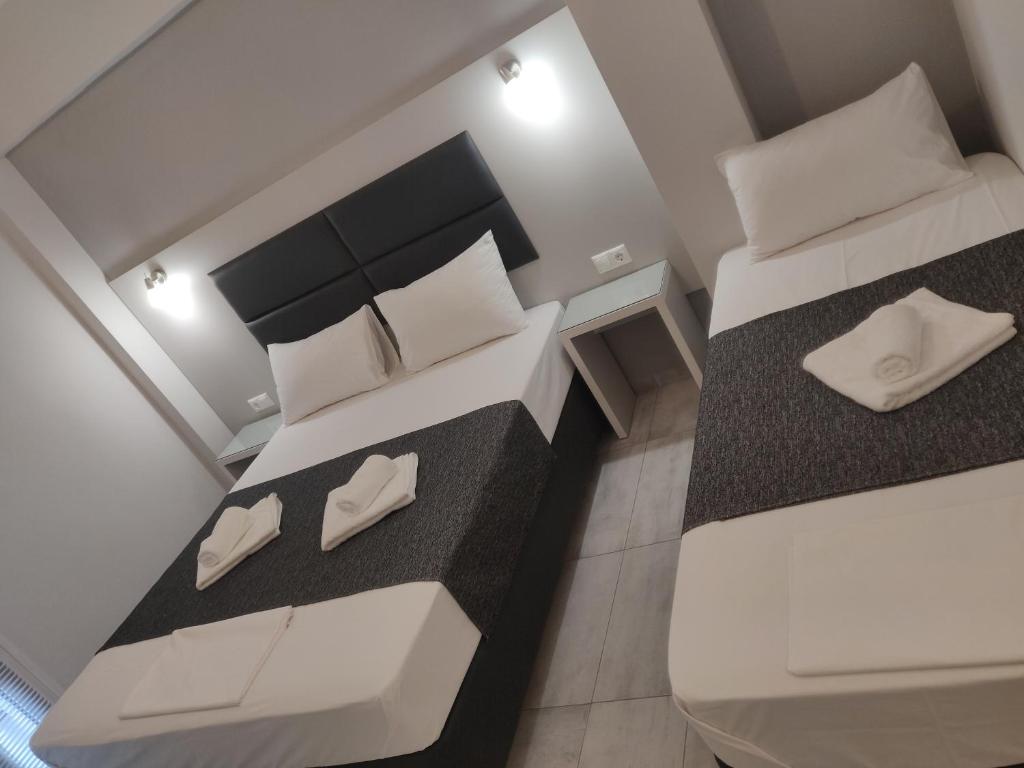 Postel nebo postele na pokoji v ubytování Alexion Apartments