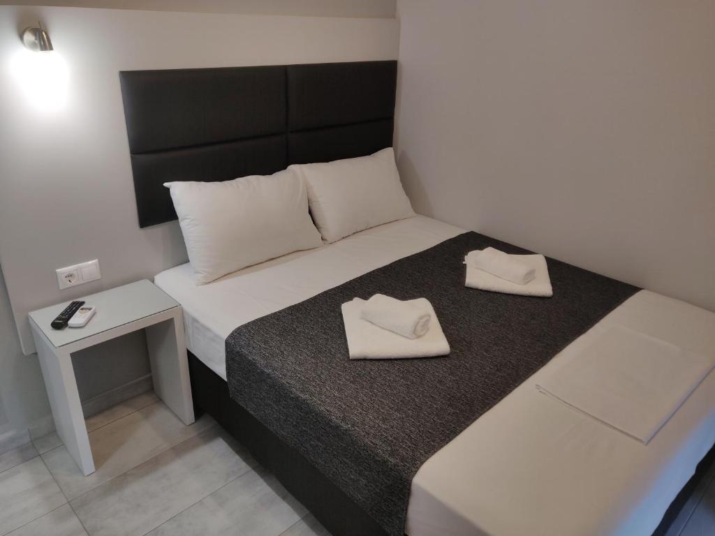 Postel nebo postele na pokoji v ubytování Alexion Apartments