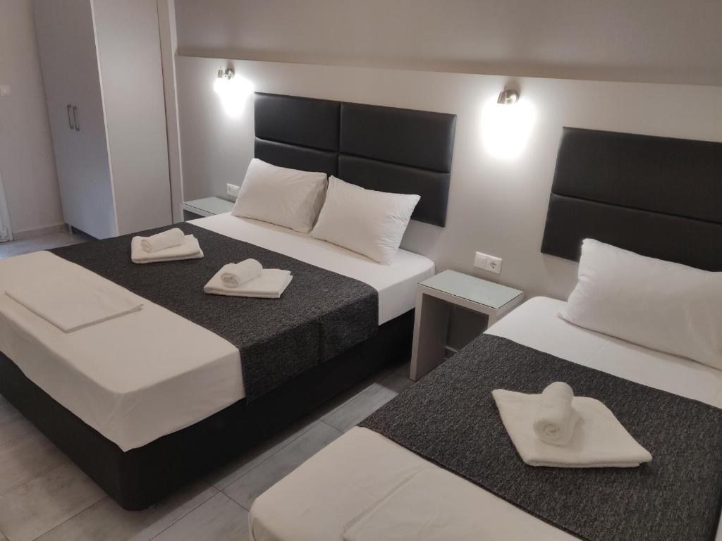 Postel nebo postele na pokoji v ubytování Alexion Apartments