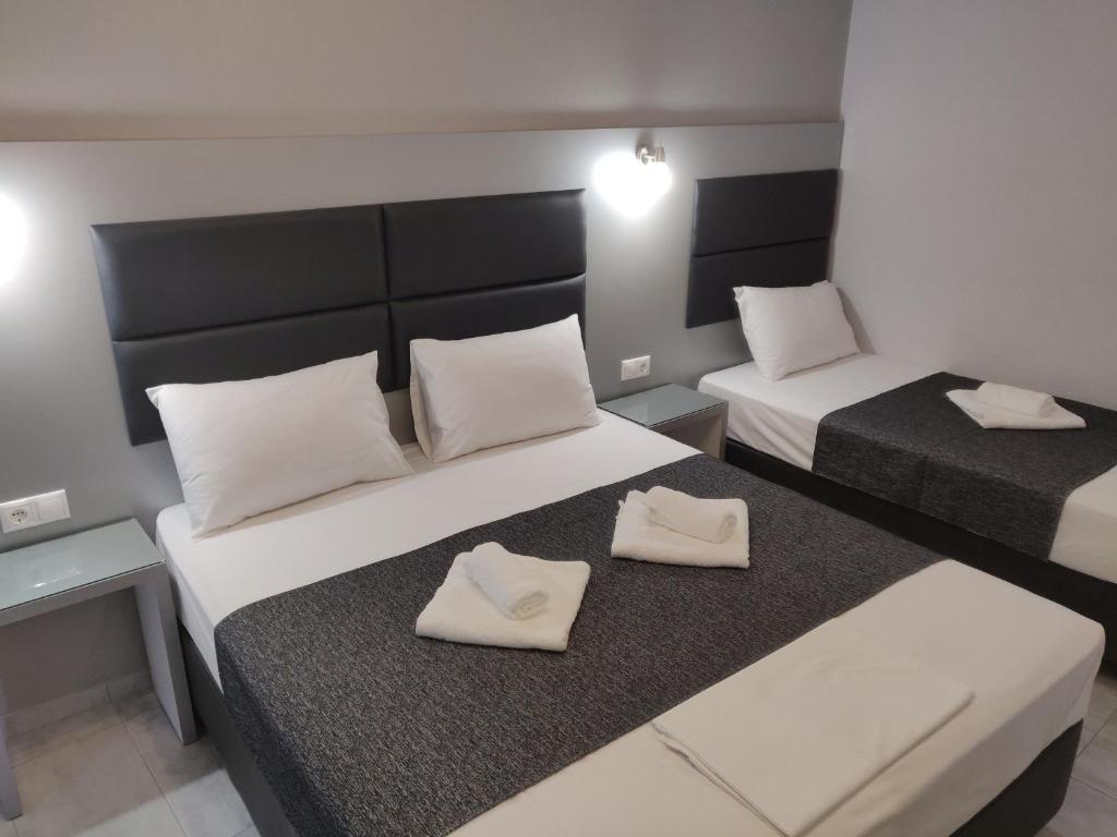 Postel nebo postele na pokoji v ubytování Alexion Apartments