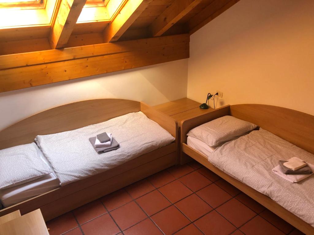 Postel nebo postele na pokoji v ubytování Appartamenti Al Ploz