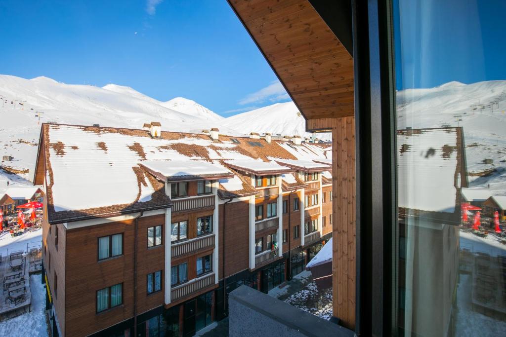 Nespecifikovaný výhled na hory nebo výhled na hory při pohledu z apartmánu