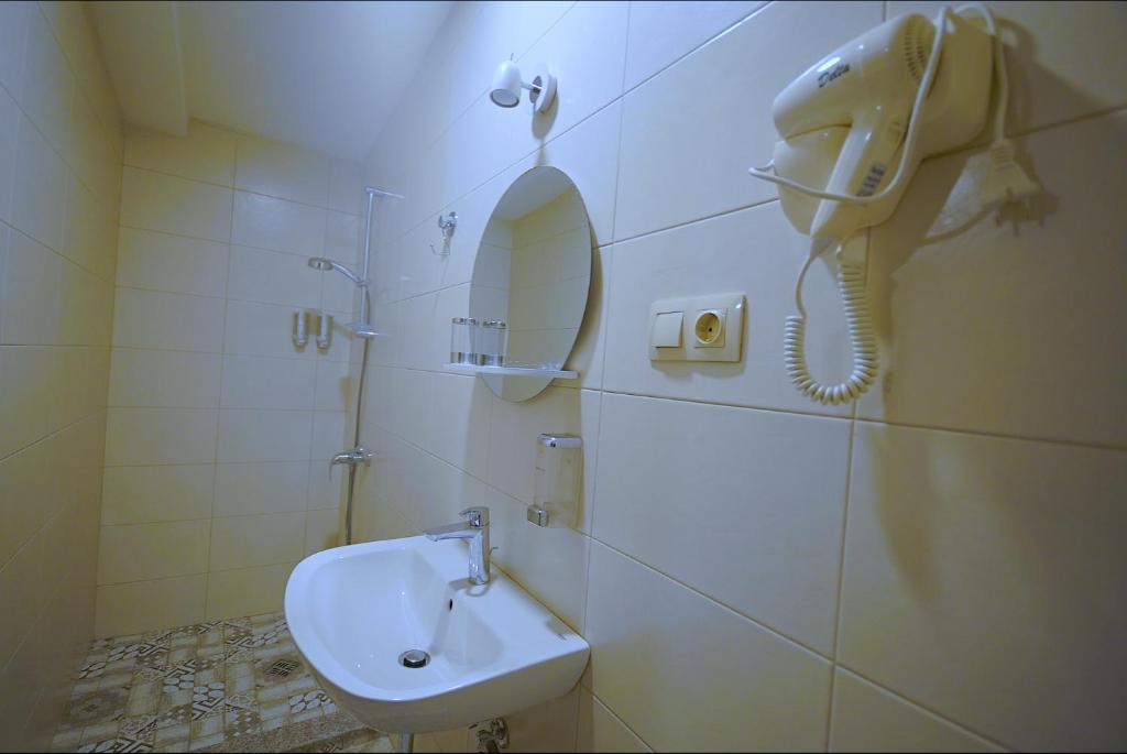 Koupelna v ubytování Hotel Cordata