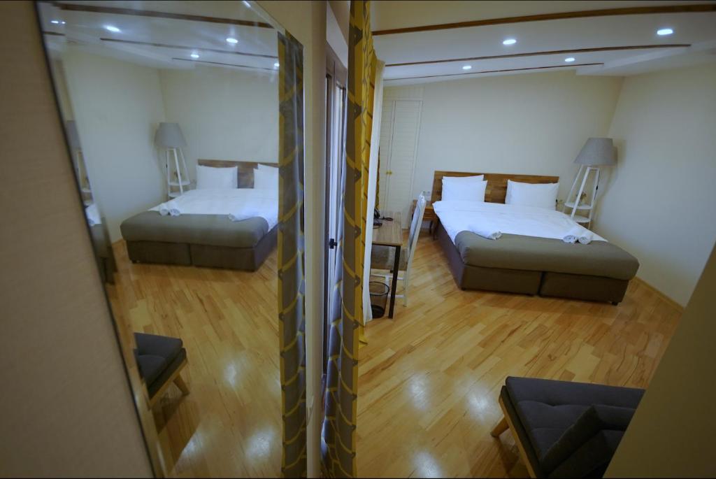 Postel nebo postele na pokoji v ubytování Hotel Cordata
