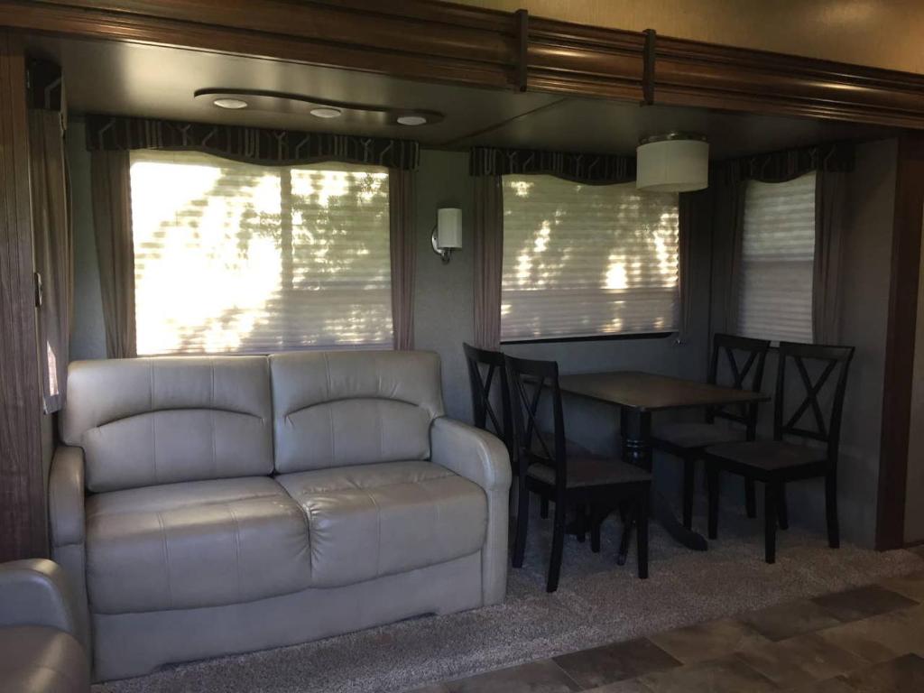 a living room with a couch and a table at Sequoia Forest Retreat in Badger