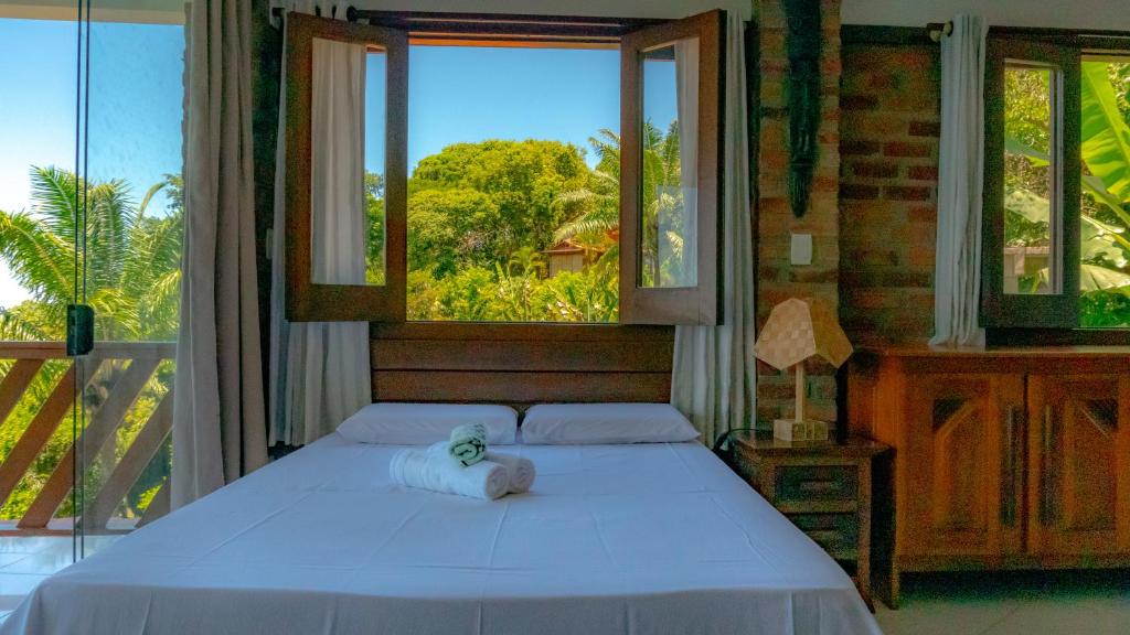 Postel nebo postele na pokoji v ubytování Pousada Residence Vila das Flores