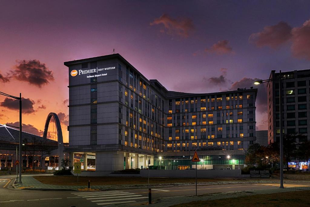 a building with a sign on the side of it at Best Western Premier Incheon Airport Hotel in Incheon