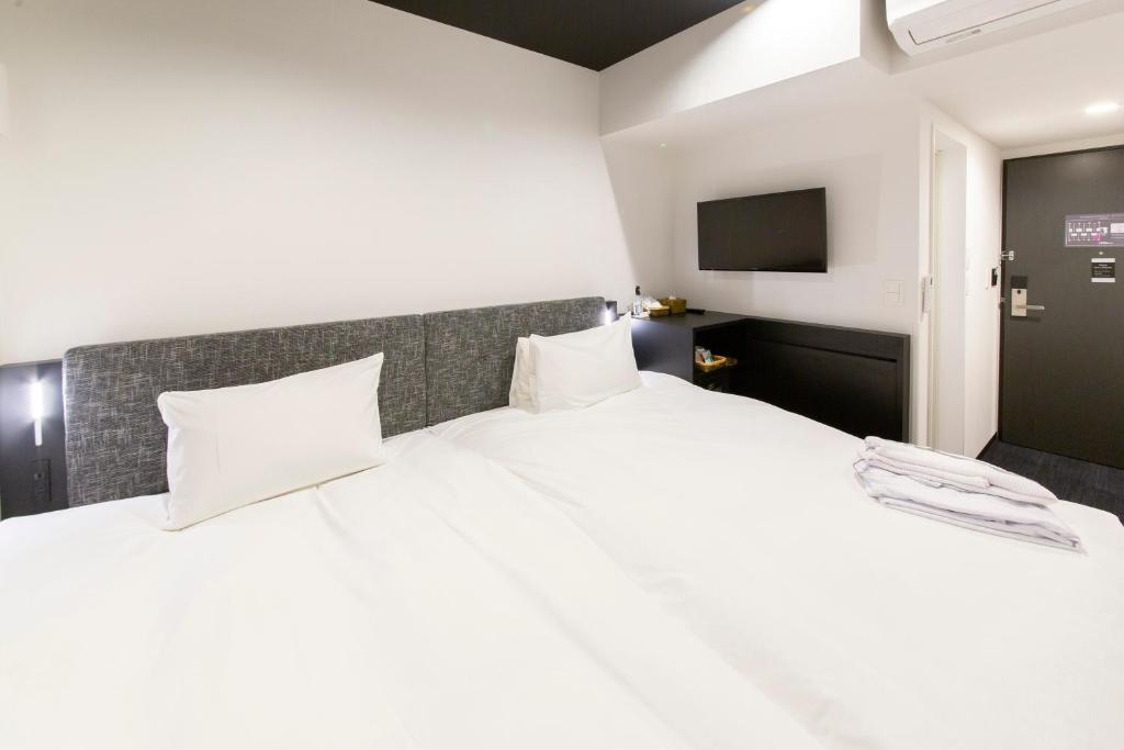 Postel nebo postele na pokoji v ubytování HOTEL TRAD Replay