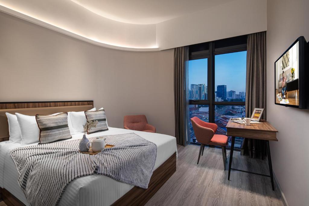 Giường trong phòng chung tại Citadines Rochor Singapore