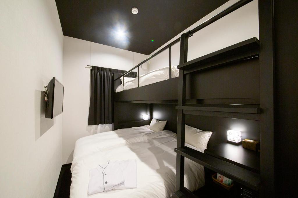 Postel nebo postele na pokoji v ubytování HOTEL TRAD Replay