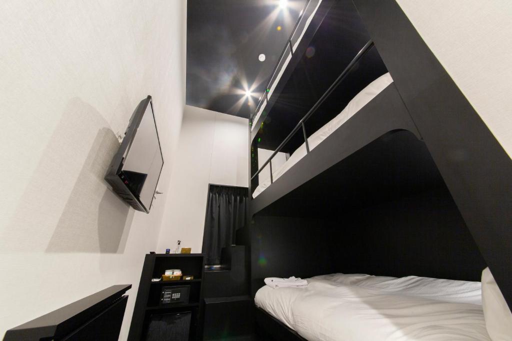 Postel nebo postele na pokoji v ubytování HOTEL TRAD Replay