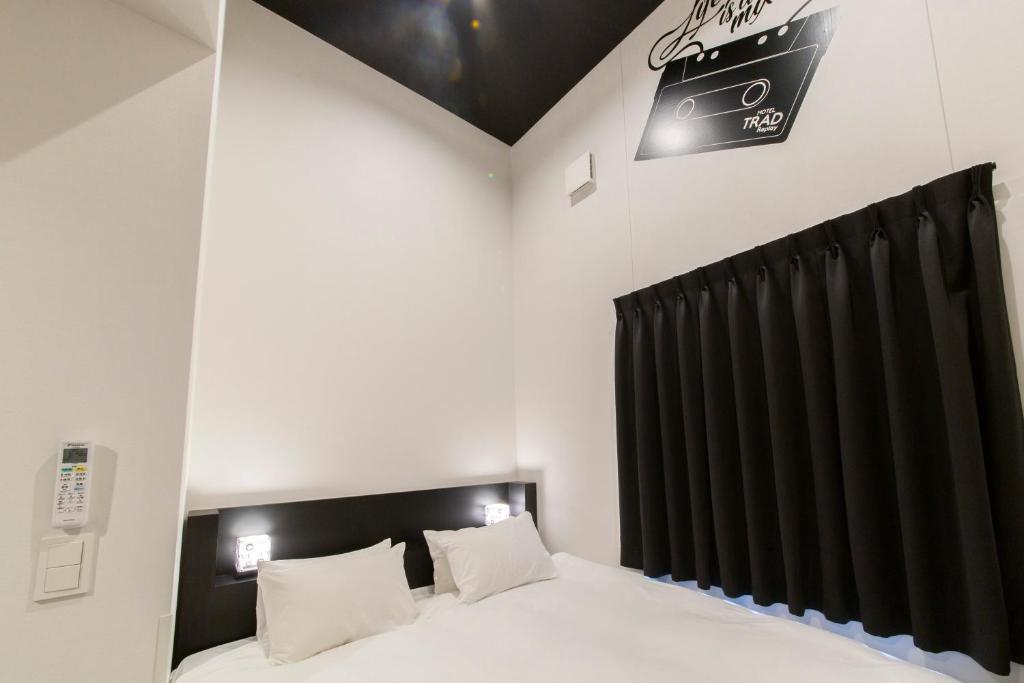 Postel nebo postele na pokoji v ubytování HOTEL TRAD Replay