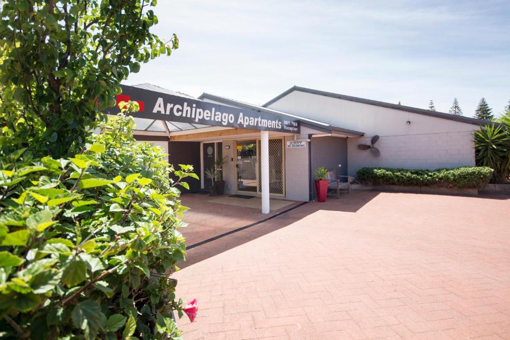 a building with a sign on the front of it at Archipelago Apartments Esperance in Esperance