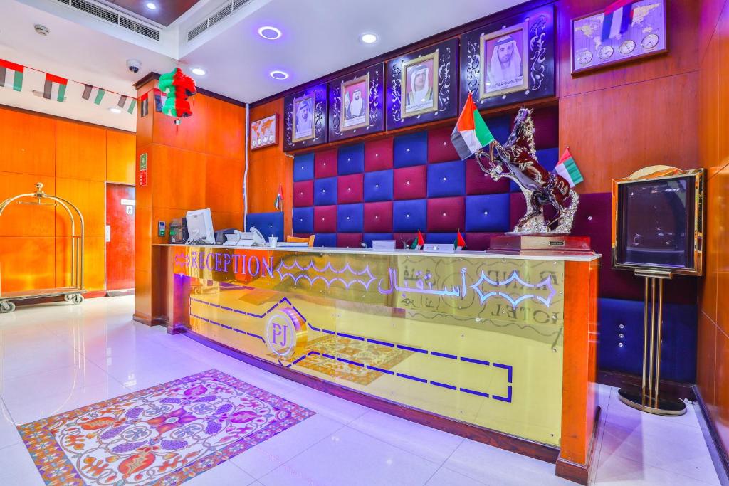 a room with a bowling alley with a tv at Grand PJ Hotel - Free Parking in Ras al Khaimah
