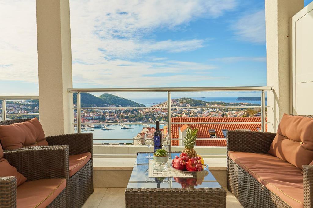 a living room with a view of the water at Apartments Muminovic in Dubrovnik