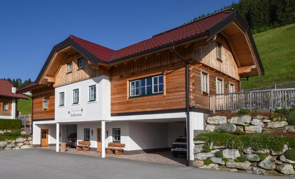 a large house with a wooden roof at Ferienhaus Johanna in Schladming