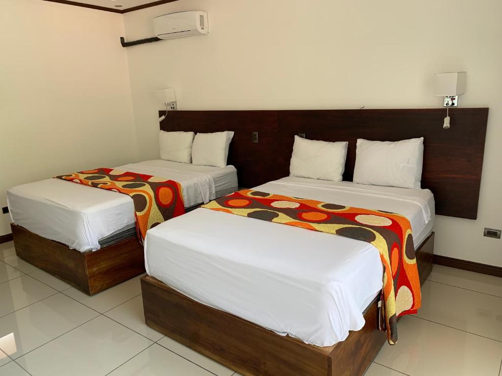 Postel nebo postele na pokoji v ubytování Hotel Manuel Antonio Park