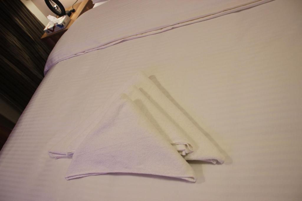 Postel nebo postele na pokoji v ubytování Farida Pyramids Boutique Hotel