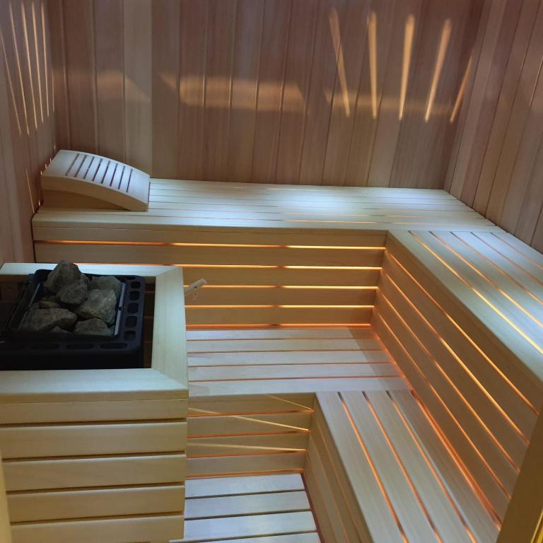 an empty sauna with a stove in it at Villa Biser Dunava in Vukovar