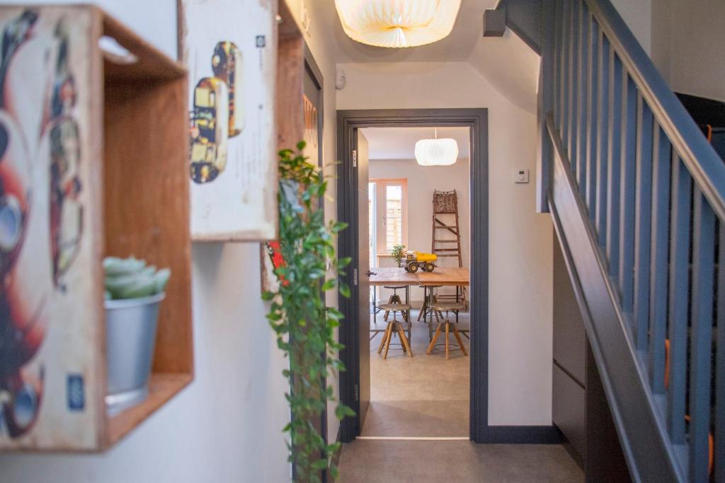 a hallway of a house with a dining room at higgihaus #3a 4 Bed Sleeps up to 12 Big Groups Hip Location in Bristol