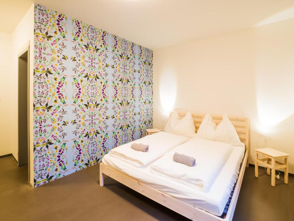 Ένα ή περισσότερα κρεβάτια σε δωμάτιο στο Hostel Zahrada Mikulov