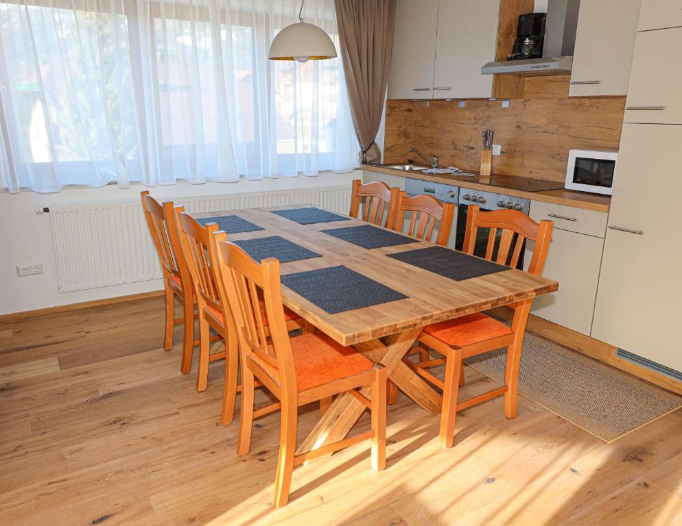 A kitchen or kitchenette at Appartementhaus Römerhof Superior - Kärnten Card Sommer inklusive
