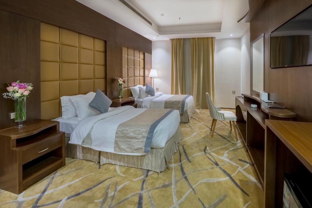 Voodi või voodid majutusasutuse Sansa Hotel toas