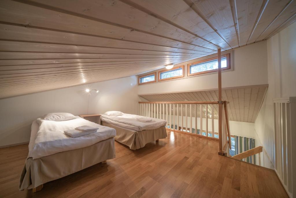 Кровать или кровати в номере Apartments Tahko