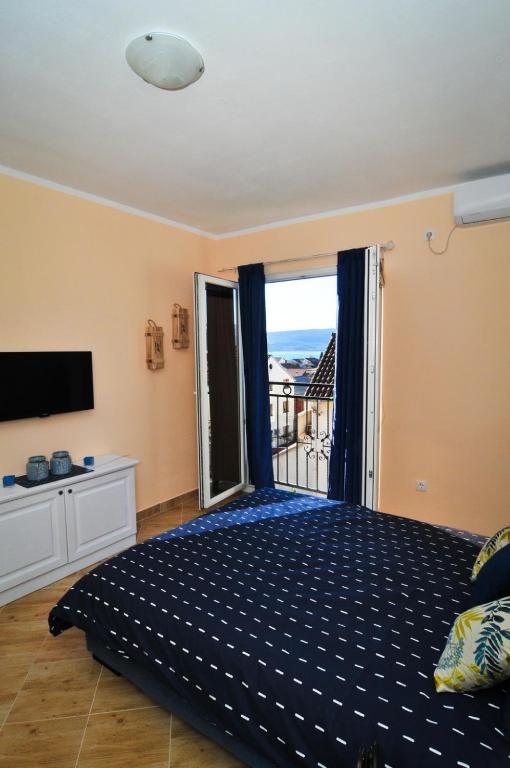 Postel nebo postele na pokoji v ubytování Apartments M&T